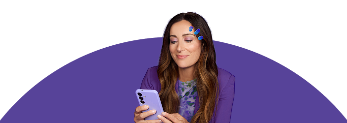 Woman in purple holding eye drops
